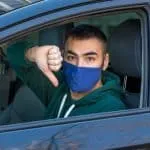 Unhappy driver gives a thumbs down