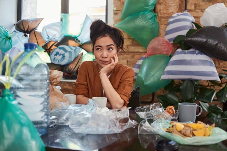 Woman surrounded by clutter