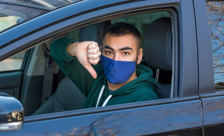 Unhappy driver gives a thumbs down